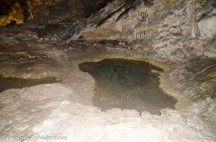 There are many pools of water on the cavern floor. This one is known as Mirror Lake.