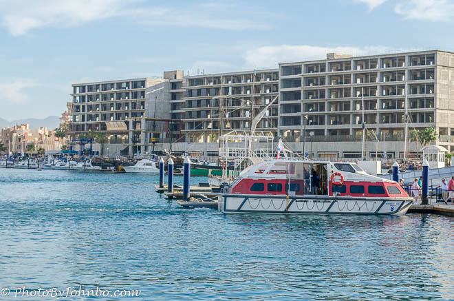 One of the Pearl’s tenders docked in front of a huge vacation condo under construction by the marina.